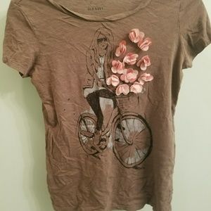 Brown t-shirt with girl on a bike